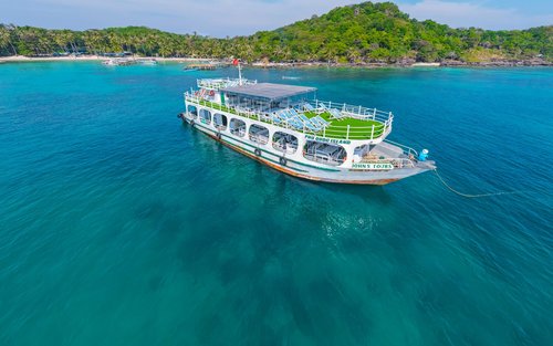 A rugged coastline meeting the turquoise ocean water.
